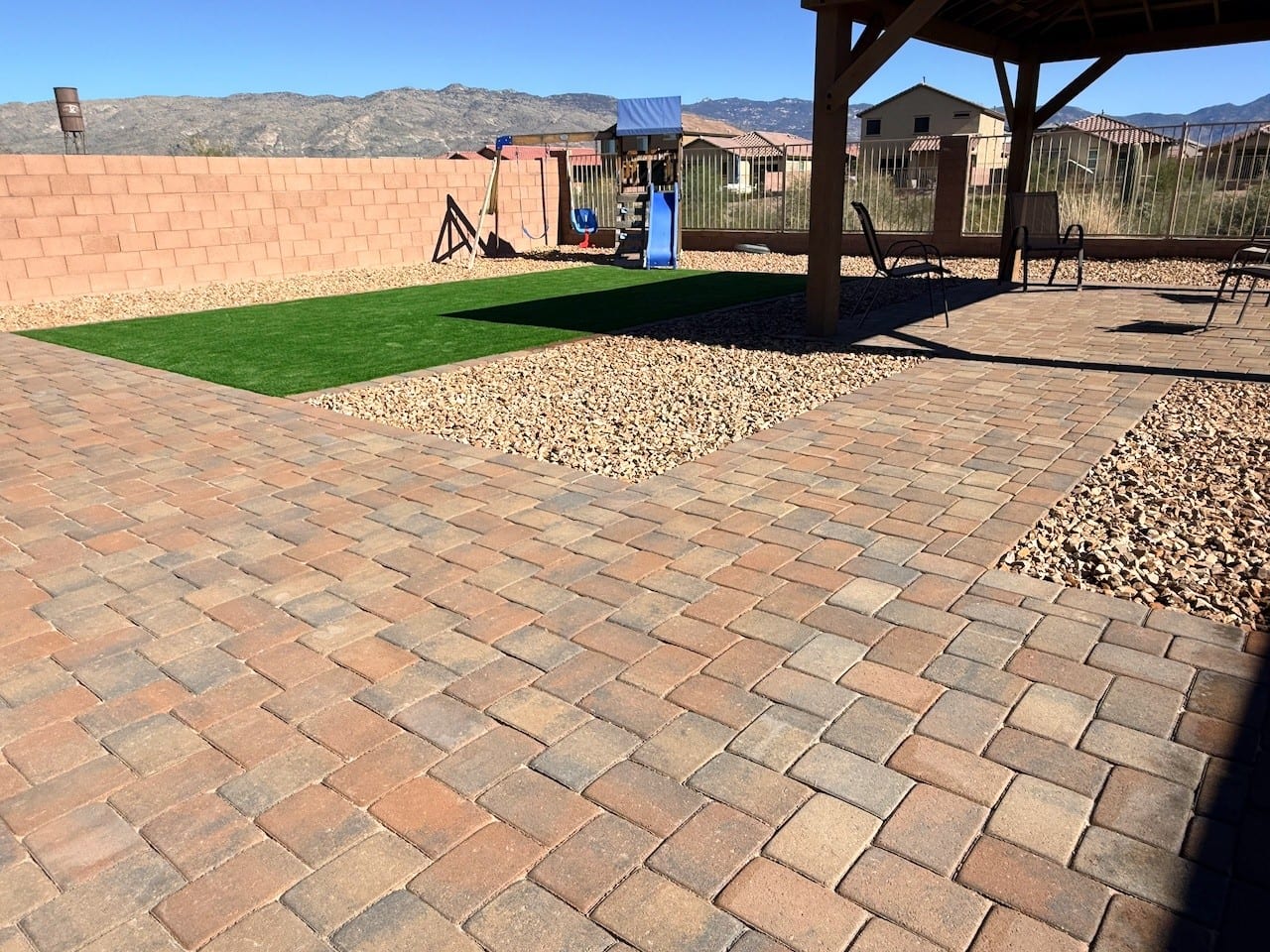 Wood ramada over a paver patio with artificial turf in a Tucson backyard by Sorce Signature Outdoors